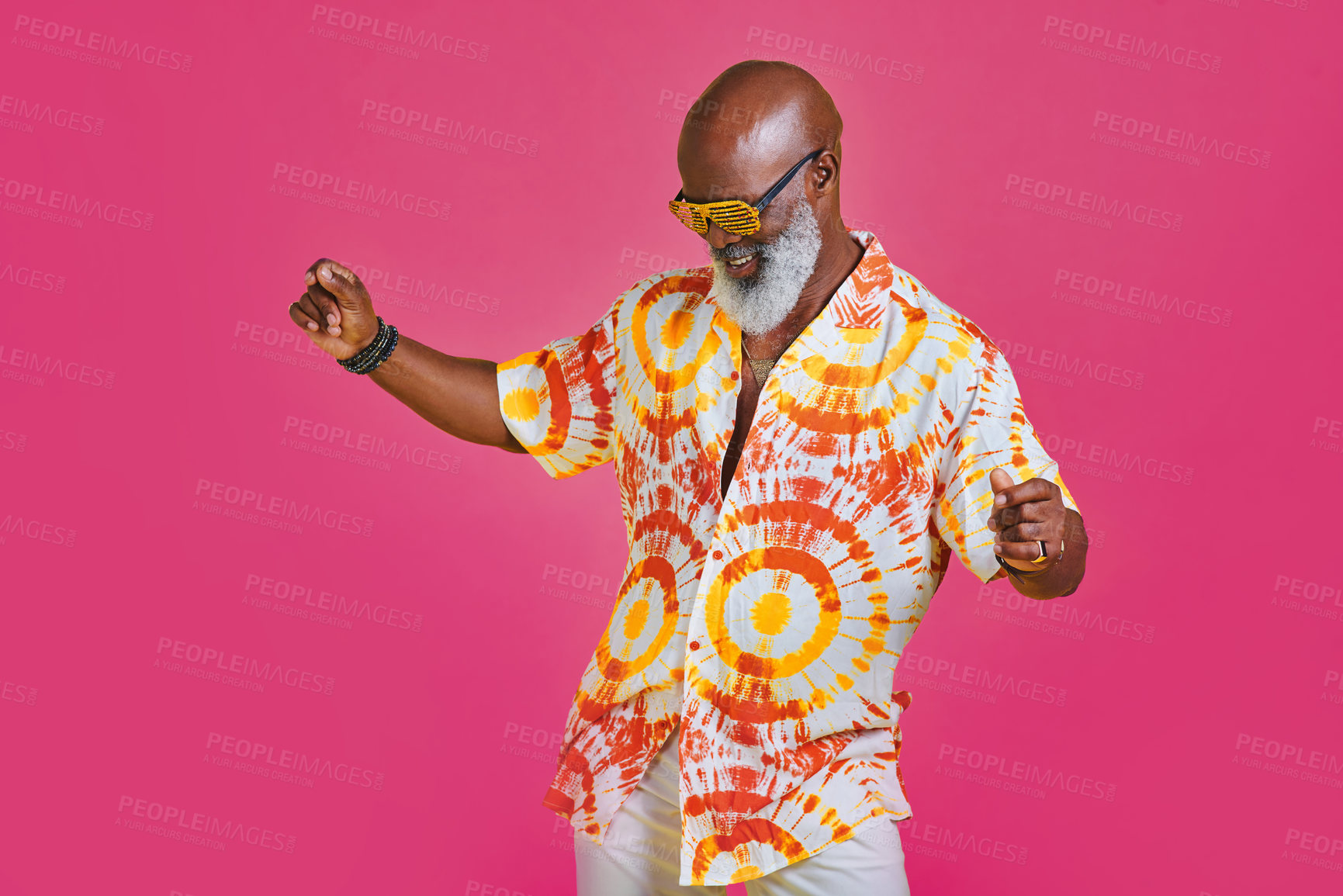 Buy stock photo Cropped shot of a funky and stylish senior man dancing in studio against a pink background
