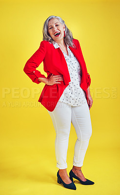 Buy stock photo Full length shot of a funky and stylish senior woman posing in studio against a yellow background
