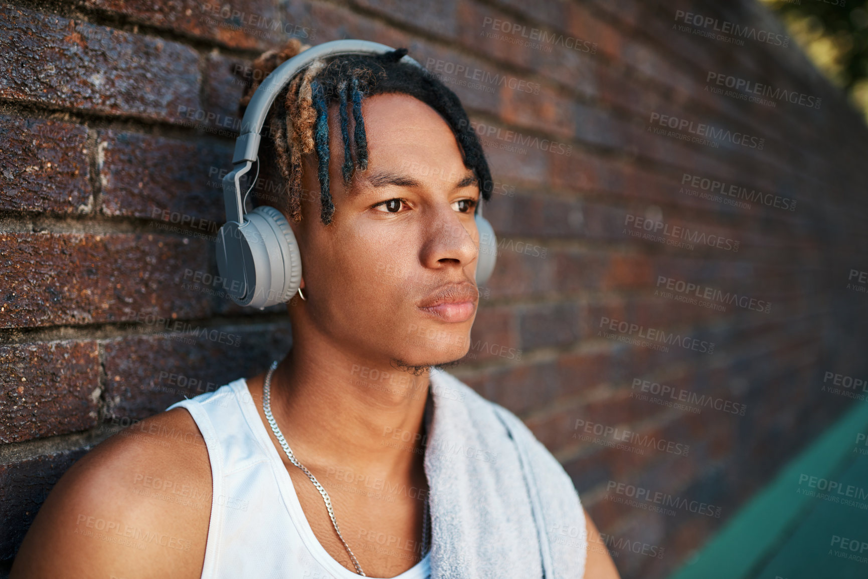 Buy stock photo Man, headphones and outdoor on basketball court with music for challenge, cardio or training. Male person, podcast and athlete in sports for competition, exercise and game with listening or streaming