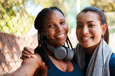 Buy stock photo Portrait of two sporty young women taking selfies together outdoors