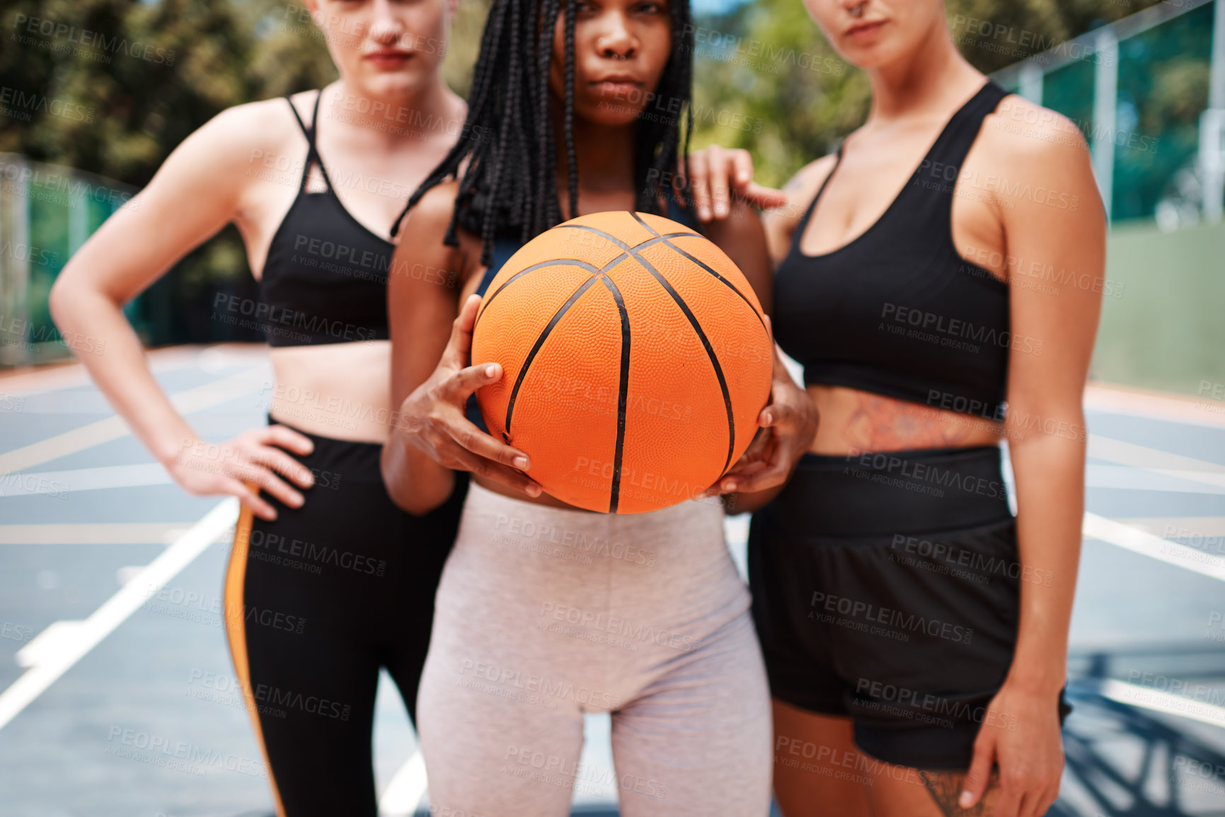 Buy stock photo Closeup shot of a group of sporty women standing together on a basketball court