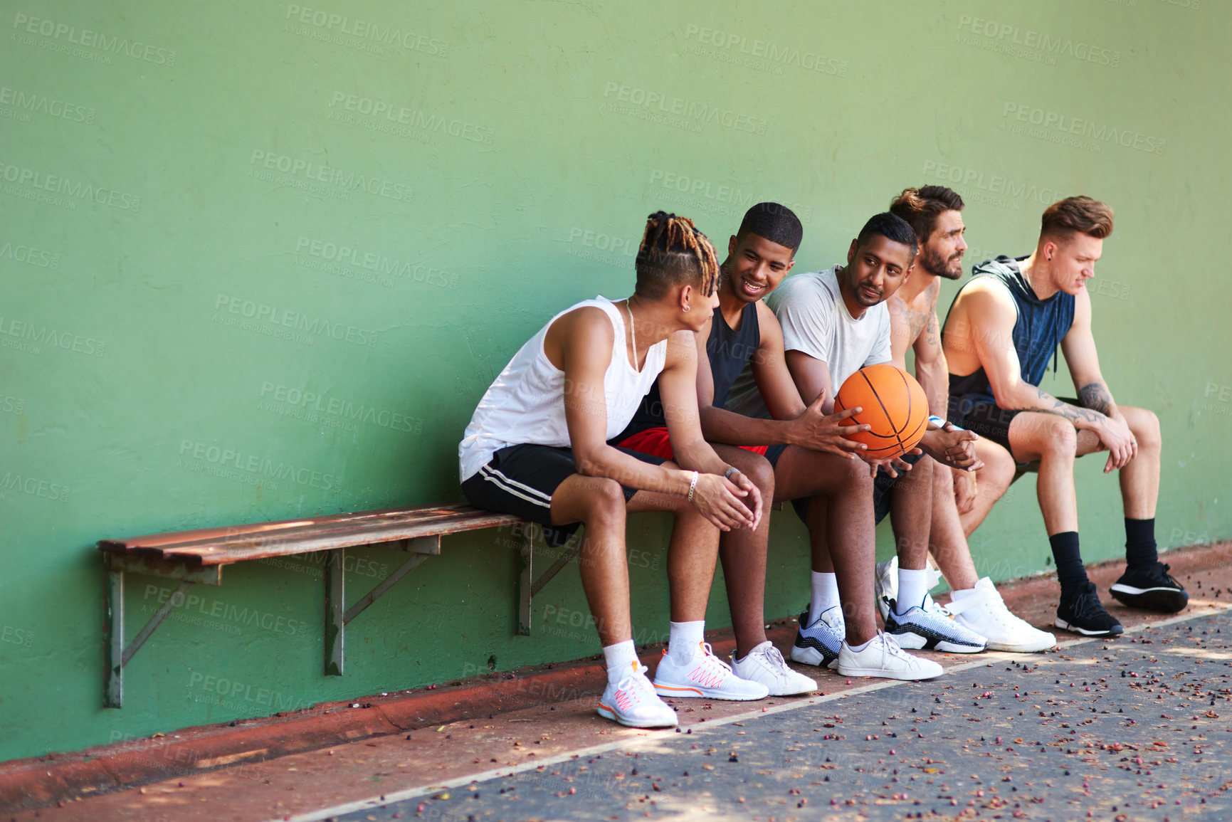 Buy stock photo Bench, basketball team or people relax on court for break, fitness exercise and wellness in sports match. Friends talking, athlete or group of healthy players resting for performance, workout or game