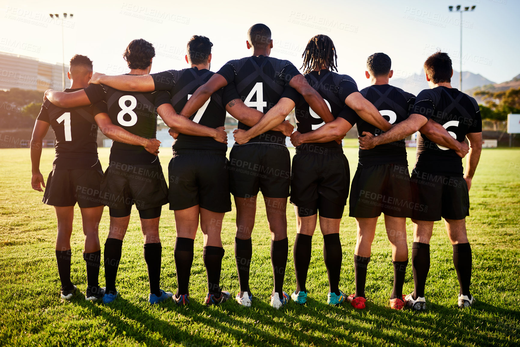 Buy stock photo Men, back or rugby team standing in stadium for sports game, group or challenge on field together. Professional, ready or legs of players in line or row for respect, unity or tournament competition