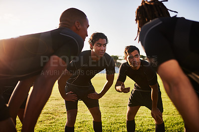 Buy stock photo Cropped shot of a diverse group of sportsmen huddled together before playing a game of rugby