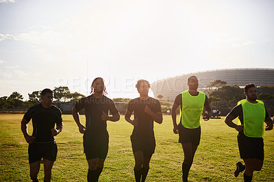 Buy stock photo Sports, people and men with warm up for rugby, competition game and practice with training for tournament. Stadium, team and players with running for fitness, endurance and match with club by flare