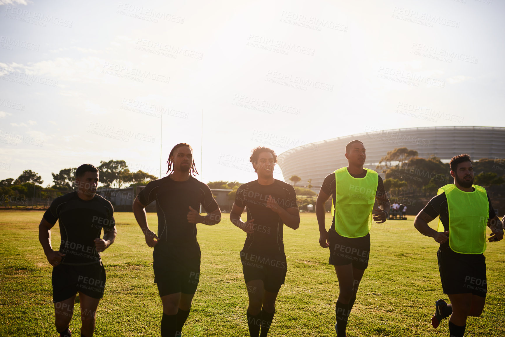 Buy stock photo Sports, people and men with warm up for rugby, competition game and practice with training for tournament. Stadium, team and players with running for fitness, endurance and match with club by flare