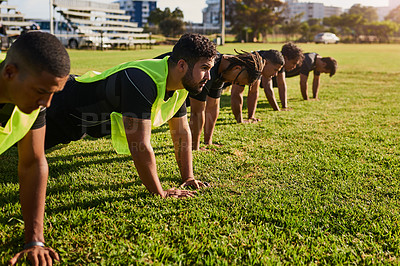Buy stock photo Cropped shot of a diverse group of sportsmen training during a rugby practice in a sports club