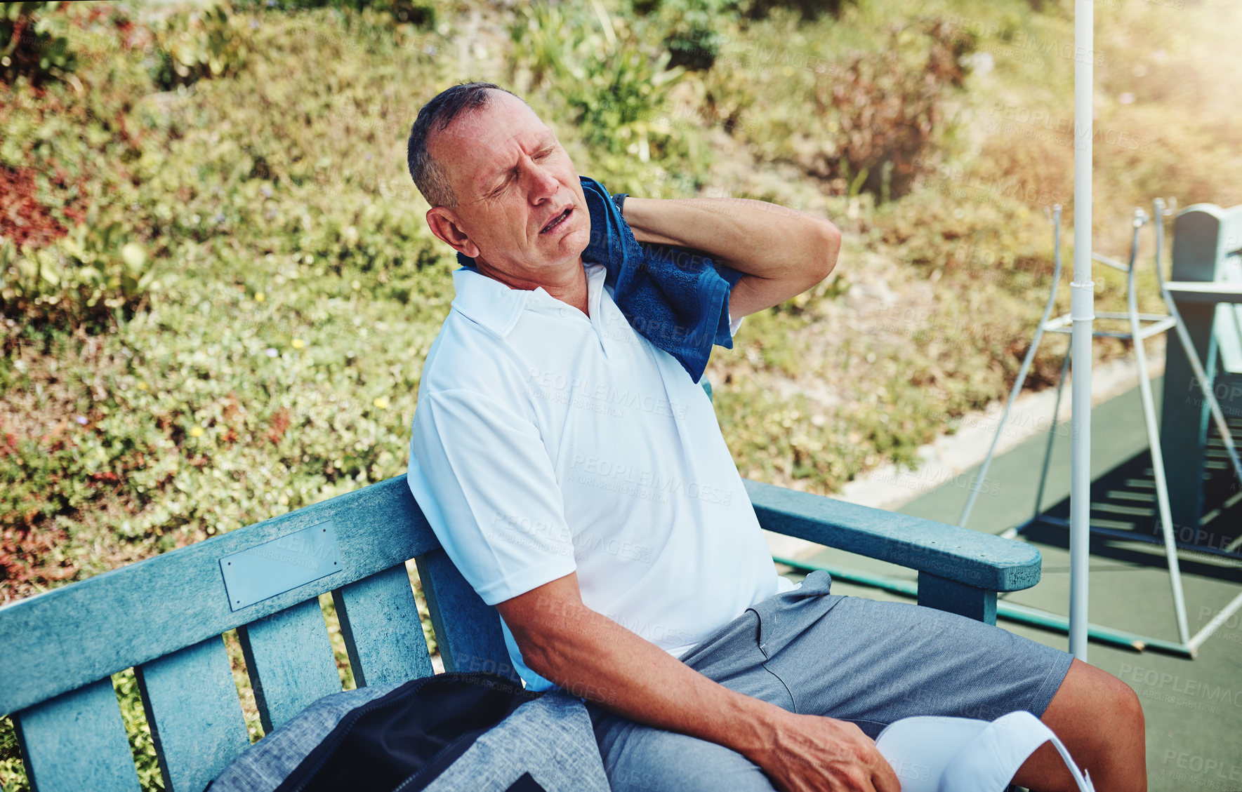 Buy stock photo Mature man, tired and sports with towel at court for fitness,  training and recovery in exercise. Outdoor, practice and male athlete with cloth on bench for workout challenge, fatigue or wiping sweat