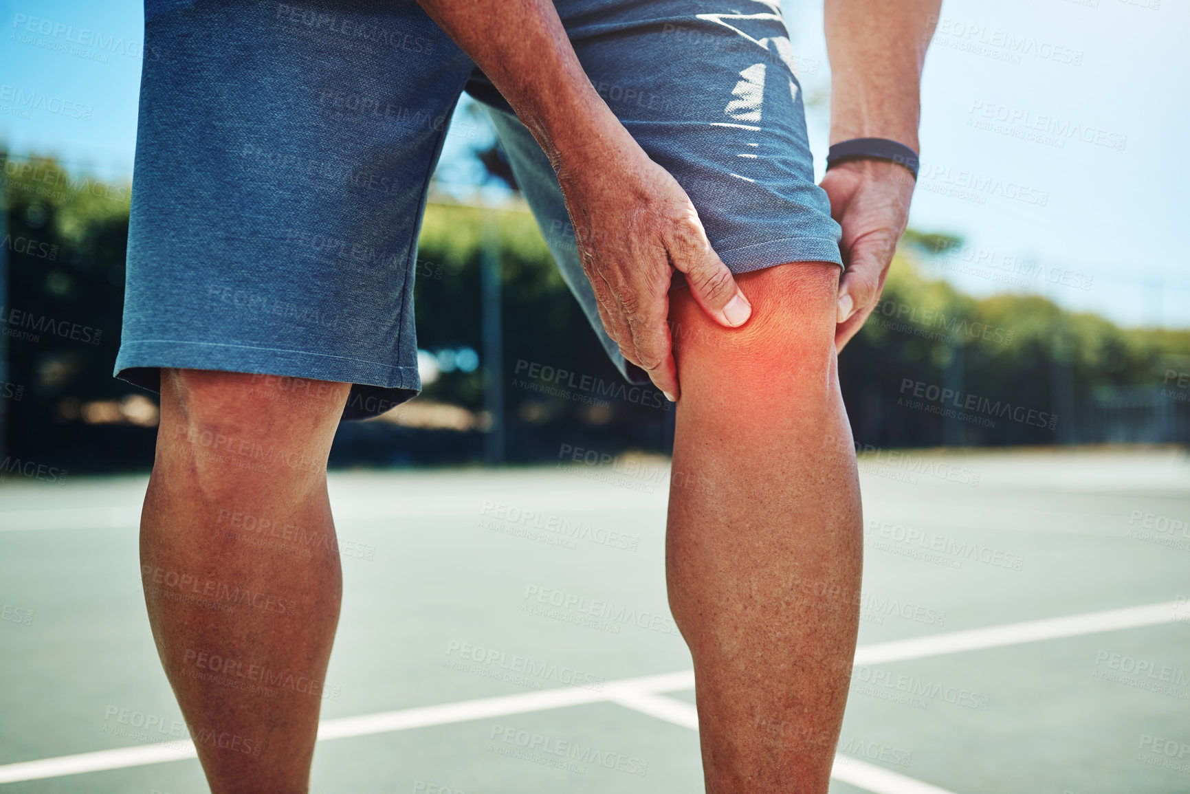 Buy stock photo Fitness, man and tennis player on court with knee pain, injury or accident at game, training or exercise. Sports, red glow and male athlete with sprain leg muscle or torn ligament at outdoor match.