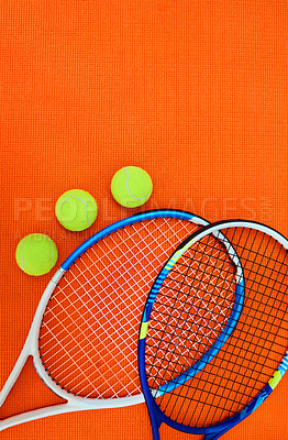 Buy stock photo Ball, racquet and space in studio for tennis competition, match or fitness challenge at health club. Sports, gear and exercise equipment on court for international games, mockup and orange background