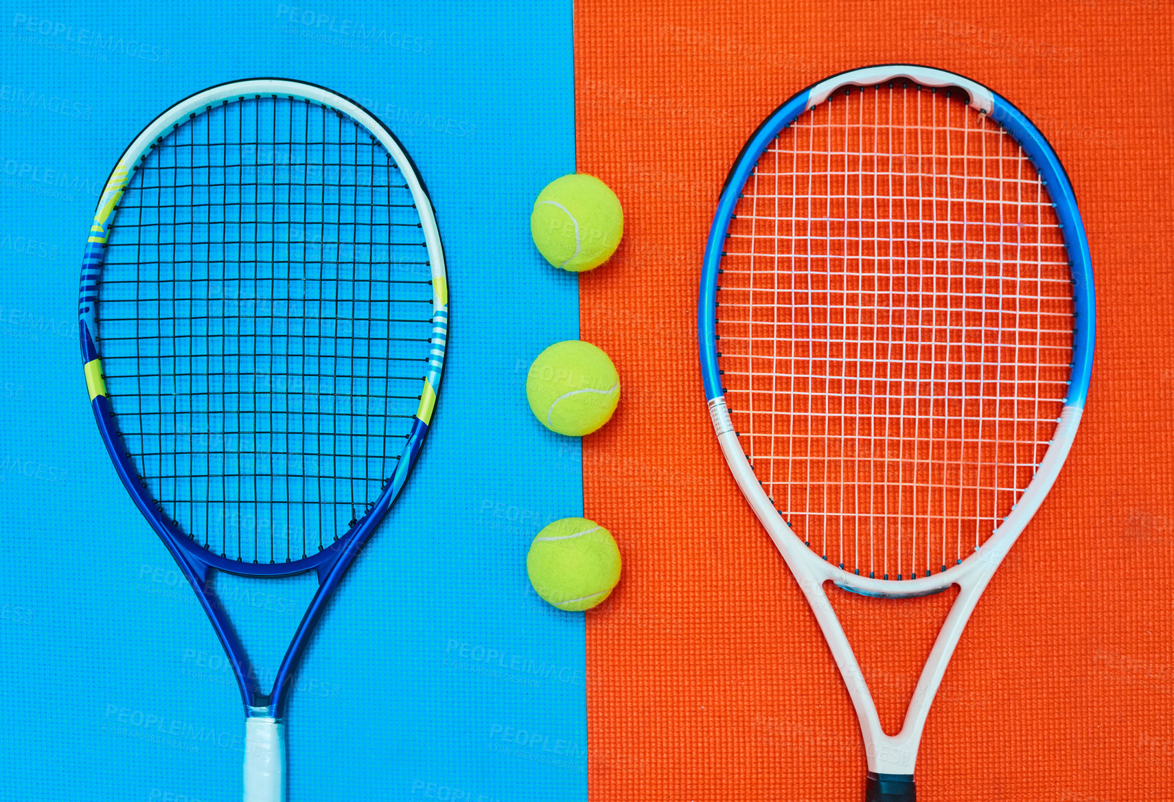 Buy stock photo High angle shot of tennis essentials placed on top of a colourful background inside of a studio