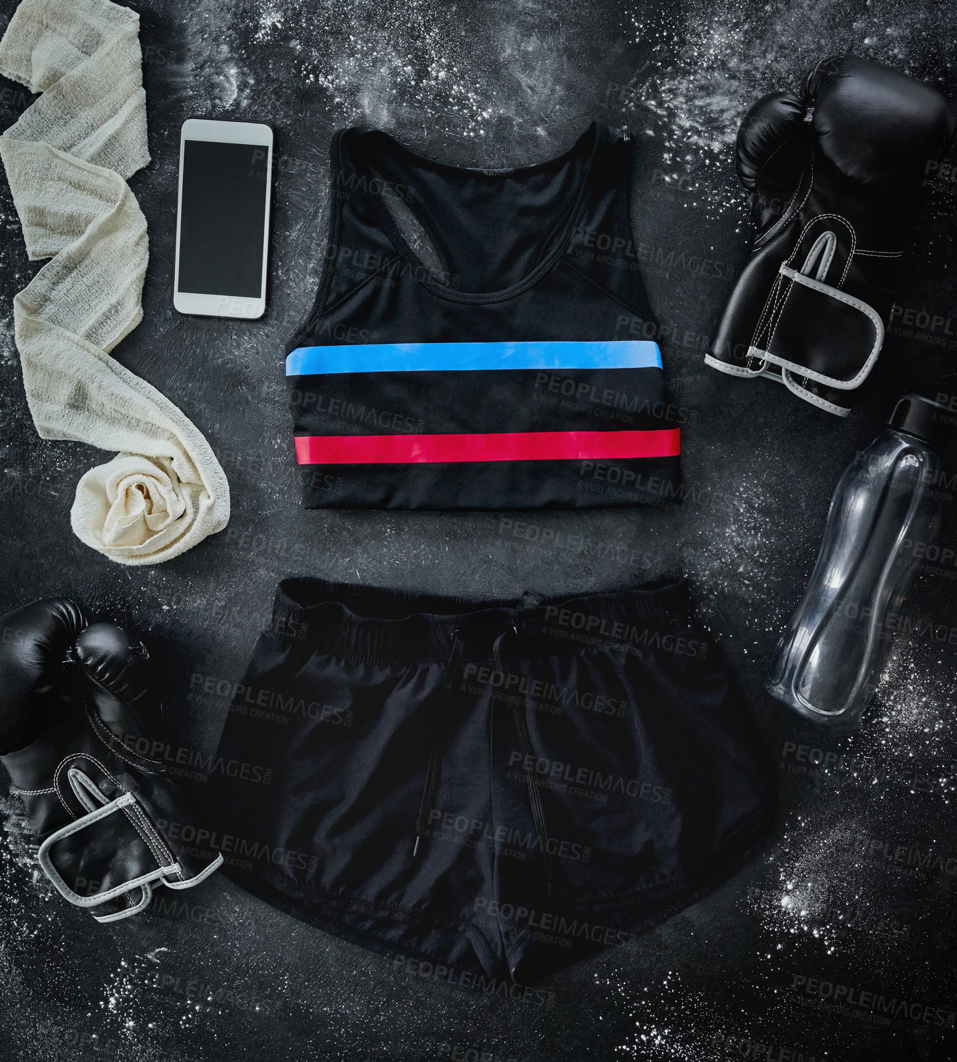 Buy stock photo High angle shot of boxing essentials placed on top of a dark background inside of a studio