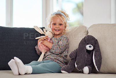 Buy stock photo Happy, little girl and portrait with bunny on sofa for toys, weekend or playing at home. Young child, female person or playful kid with smile for stuffed animal, youth or childhood on couch at house