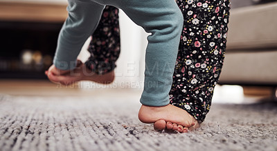 Buy stock photo Cropped shot of an unrecognizable mother and daughter dancing together in the living room at home