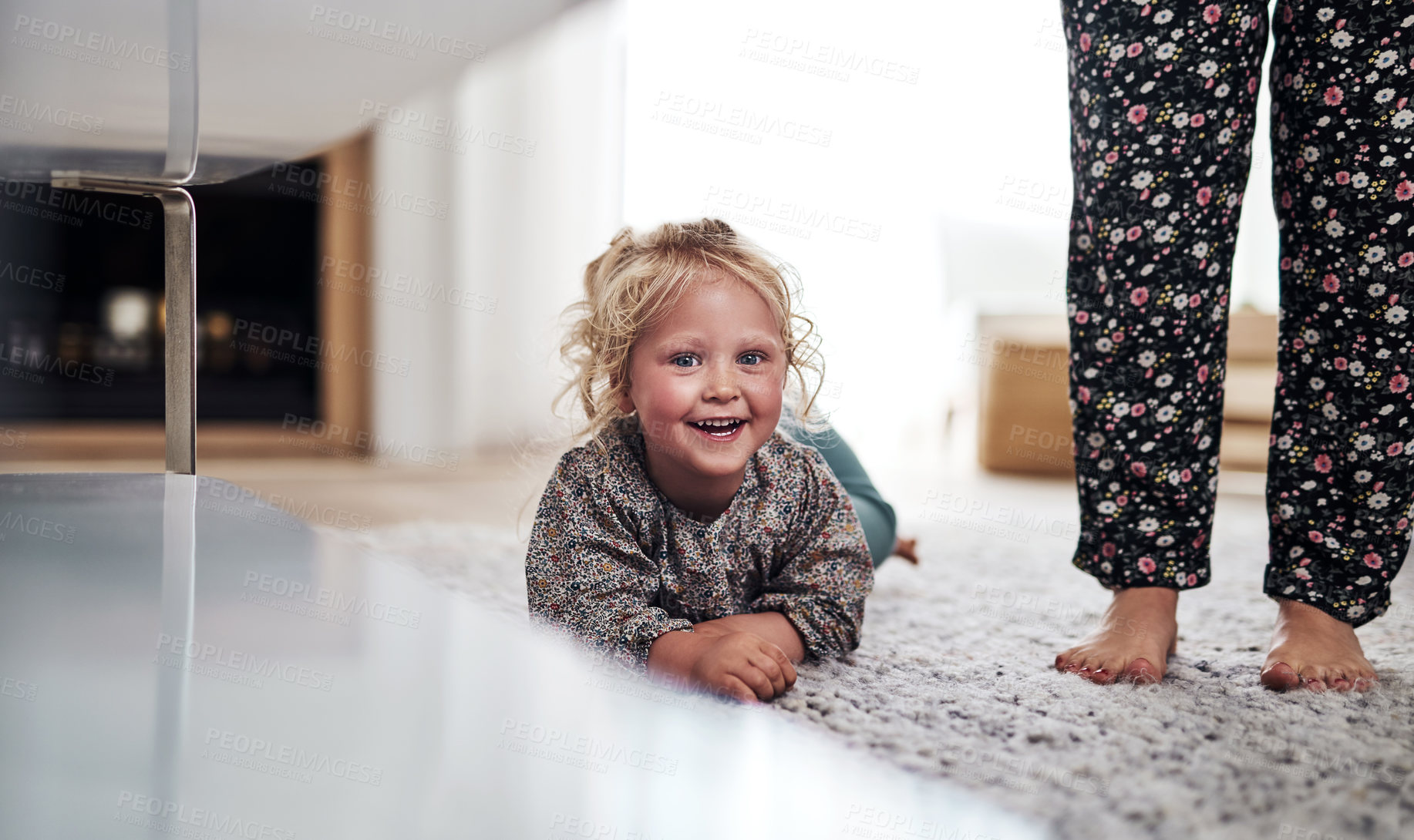 Buy stock photo Cropped portrait of an adorable little girl bonding with her mother during a day at home