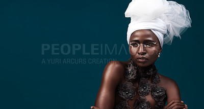 Buy stock photo Art, fashion and a thinking black woman for culture isolated on a dark background in a studio. Mockup, idea and an African person wearing traditional headwear with cosmetics for cultural confidence