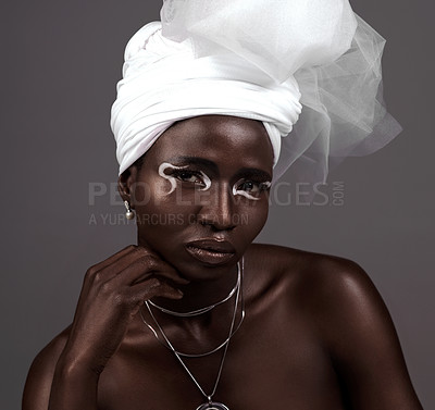 Buy stock photo Portrait, wrap and black woman with makeup, beauty and confidence in studio on grey background. Face, glow and proud African model with traditional outfit, eyeshadow cosmetics or creative necklace