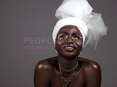 Buy stock photo Thinking, wrap and black woman with makeup, smile and beauty in studio on grey background. Fashion, turban or African model with traditional outfit, eyeshadow cosmetics or necklace for culture pride 