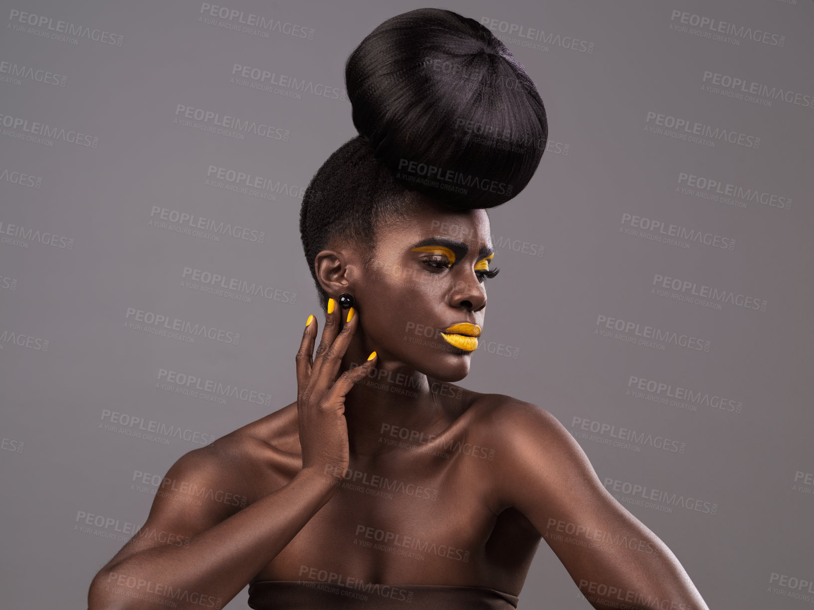 Buy stock photo Beauty, makeup and black woman in studio with lipstick, cosmetics and eyeshadow on gray background. Creative, aesthetic and female model with yellow lip balm, nail polish manicure and cosmetology