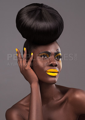 Buy stock photo African, model and studio art with makeup, beauty and creative yellow lipstick. Bold, woman and skin with confidence, dramatic hair and bun for glamour or trendy cosmetics isolated on grey background