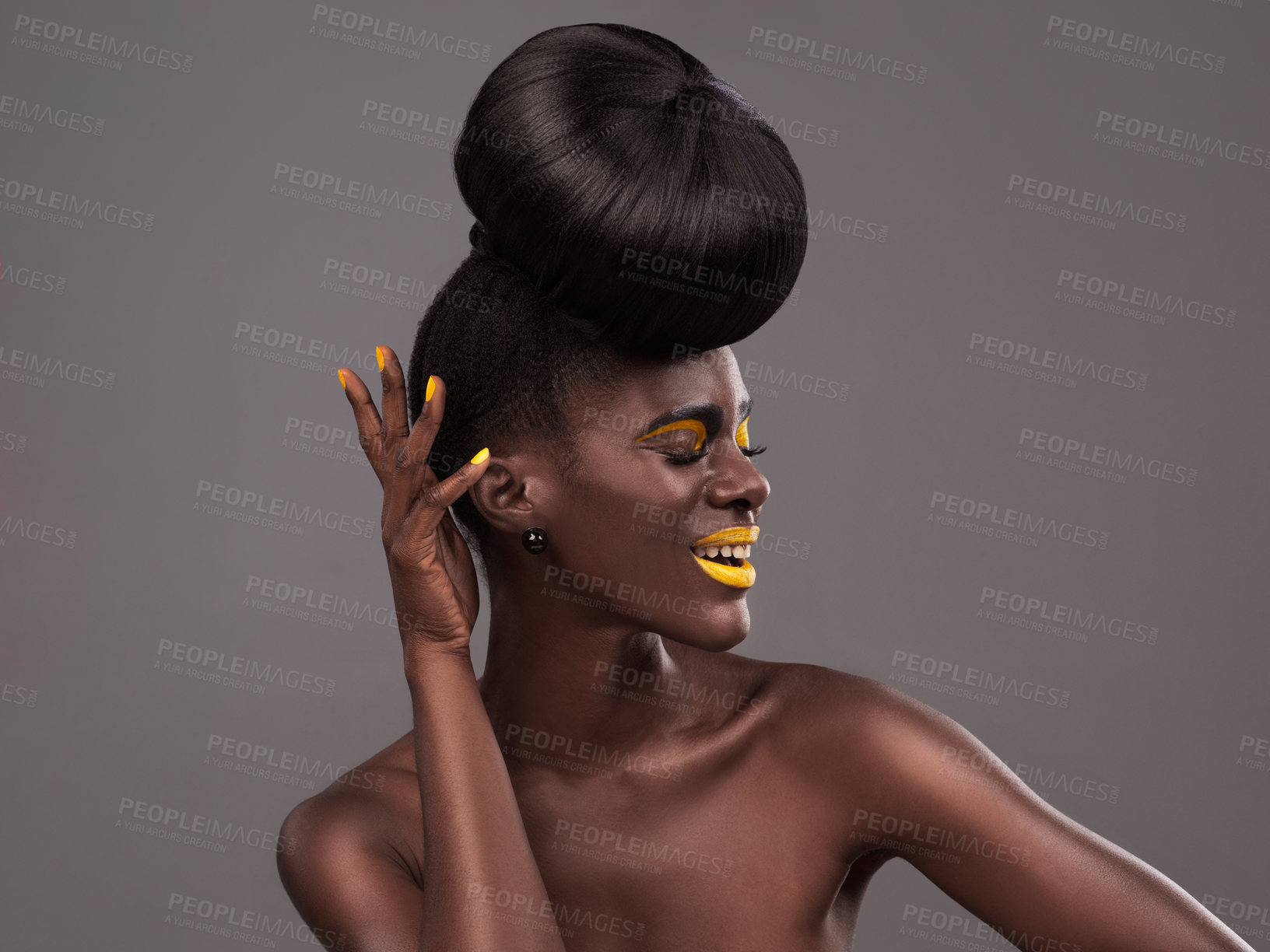 Buy stock photo Makeup, beauty and happy black woman in studio with lipstick, cosmetics and eyeshadow on gray background. Creative, aesthetic and female model with yellow lip balm, nail polish manicure and glamour