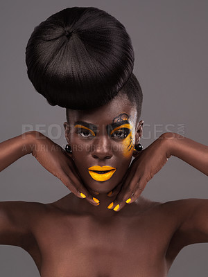 Buy stock photo African, woman and studio portrait with makeup, beauty and creative yellow lipstick. Bold, model and skin with confidence, dramatic hair and bun for glamour and trendy cosmetics on grey background