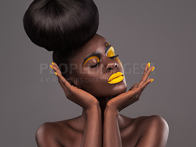 Buy stock photo African, woman and studio art with makeup, beauty and creative yellow lipstick. Bold, model and skin with confidence, dramatic hair and bun for glamour or trendy cosmetics on isolated grey background