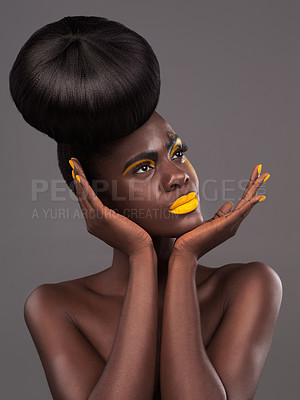 Buy stock photo African, model and studio face with art, beauty and creative yellow lipstick. Bold, woman and skin with confidence, dramatic hair and bun for glamour and trendy cosmetics or makeup on grey background