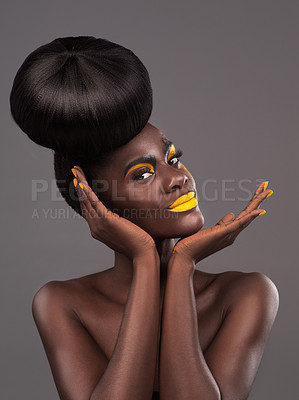 Buy stock photo African, model and studio portrait with creative, beauty and cosmetic yellow lipstick. Bold, woman and skin with confidence, dramatic hair and bun for glamour and trendy makeup on grey background