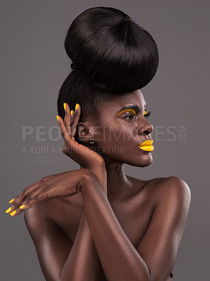 Buy stock photo African, model and studio face with creative, beauty and cosmetic yellow lipstick. Bold, woman and skin with confidence, dramatic hair and bun for glamour or trendy makeup isolated on grey background