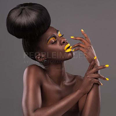Buy stock photo African, model and glamour portrait with makeup, beauty and creative yellow lipstick. Bold, woman and skin with confidence, dramatic hair and bun for studio and trendy cosmetics on grey background