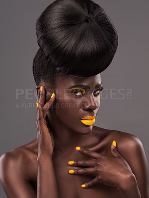 Buy stock photo African, model and studio cool with makeup, beauty and creative yellow lipstick. Bold, woman and skin with confidence, dramatic hair and bun for glamour and trendy cosmetics on grey background