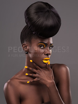 Buy stock photo African, woman and studio color with makeup, beauty and creative yellow lipstick. Bold, model and skin with confidence, dramatic hair and bun for glamour or trendy cosmetics on grey studio background