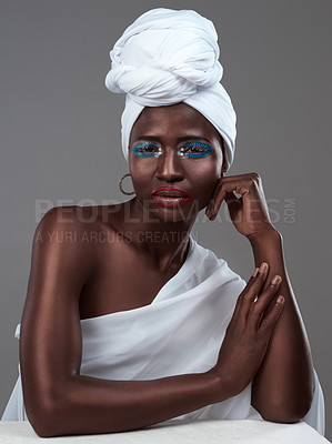 Buy stock photo African, art and woman with creative makeup, face paint and pride in beauty of indigenous culture. Studio, portrait and model with color eyeshadow, cosmetics on skin and traditional tribal fashion