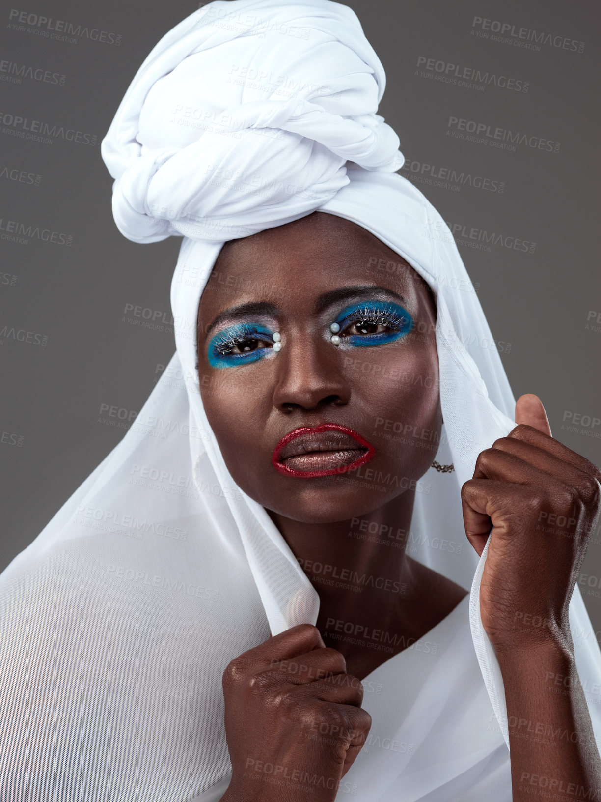 Buy stock photo Portrait, African and woman in traditional clothing or fashion with makeup, cosmetics and headwrap in studio. Female person, stylish and confident for heritage, pride and culture in grey background