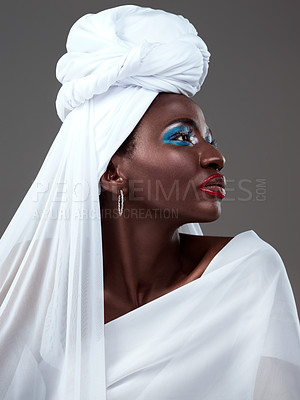 Buy stock photo Young, African and girl in traditional fashion, beauty and clothing with makeup, cosmetic and head scarf in studio. Female person, stylish and confident for heritage, pride and culture in background