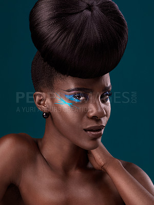 Buy stock photo Portrait, cosmetics and hair care with an african woman in studio on a blue background for beauty or makeup. Eyeshadow, hairstyle and fashion with an attractive young female model at the salon