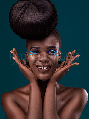 Buy stock photo Portrait, hands and makeup with an african woman in studio on a blue background for beauty or cosmetics. Face, hair or fashion with a happy and attractive young female model at the salon for style