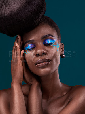 Buy stock photo Face, beauty and cosmetics with an african woman in studio on a blue background for hair or cosmetics. Eyes closed, haircare and fashion with an attractive young female model at the salon for style
