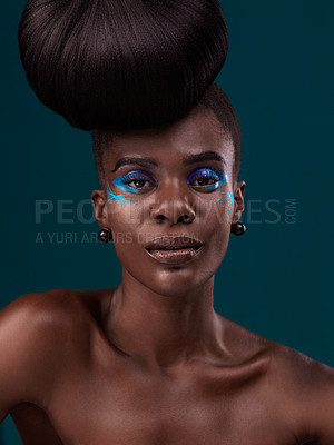 Buy stock photo Portrait, hair care and makeup with a model black woman in studio on a blue background for fashion. Face, hairstyle and cosmetics with a beautiful young female person at a salon for beauty or styling