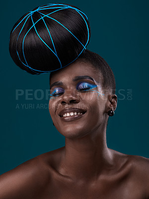 Buy stock photo Happy, hair and makeup with a model black woman in studio on a blue background for beauty. Smile, haircare and cosmetics with an attractive young female person at the salon for fashion or styling