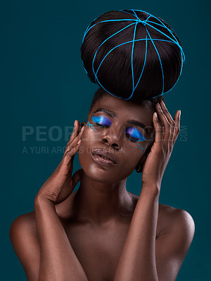 Buy stock photo Face, hair and makeup with a model black woman in studio on a blue background for beauty. Hands, haircare and cosmetics with an attractive young female person at the salon for fashion or styling