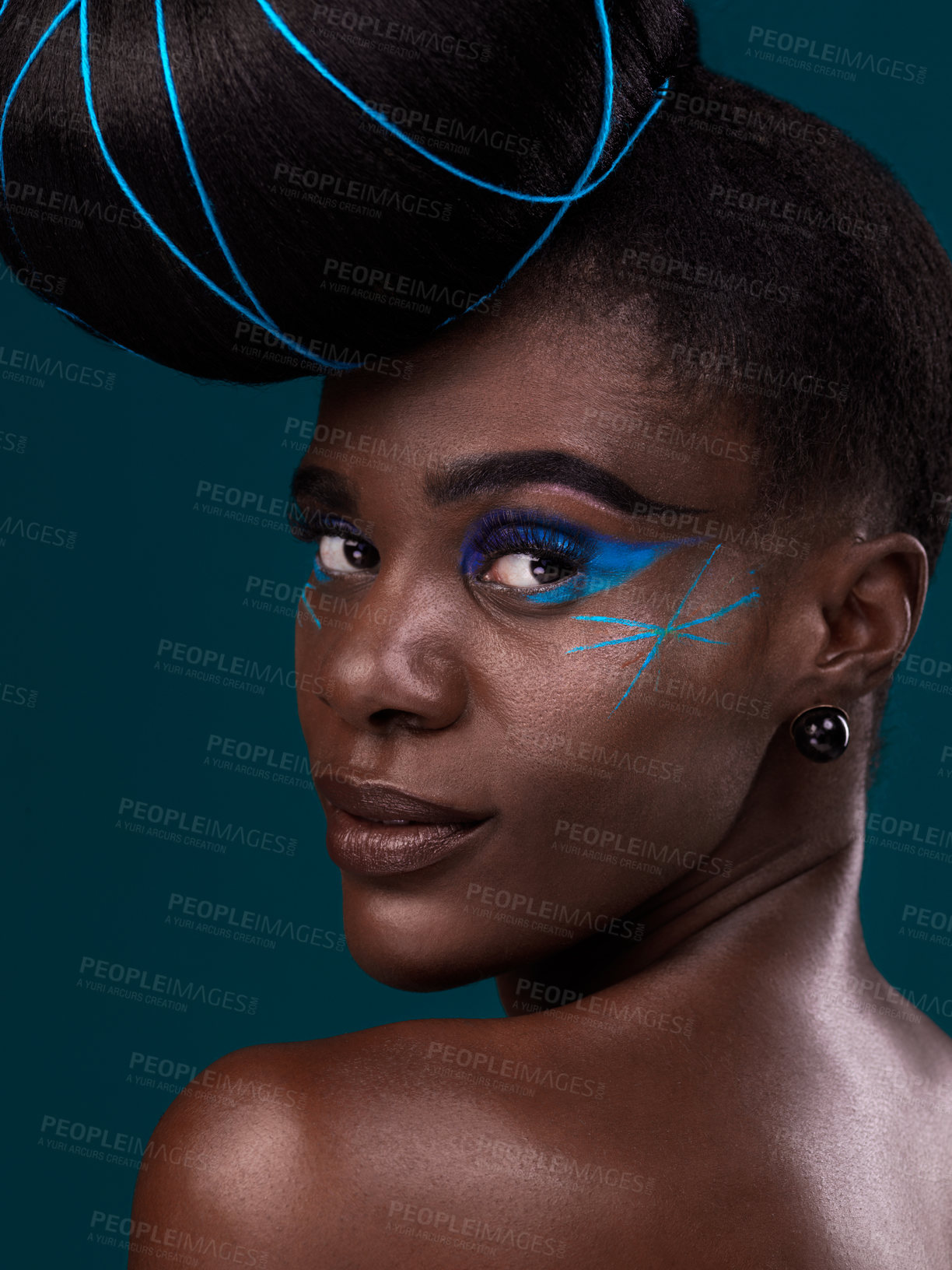 Buy stock photo Portrait, hair and rear view with a model black woman in studio on a blue background for beauty. Face, fashion and makeup with an attractive young female person looking over her shoulder at the salon