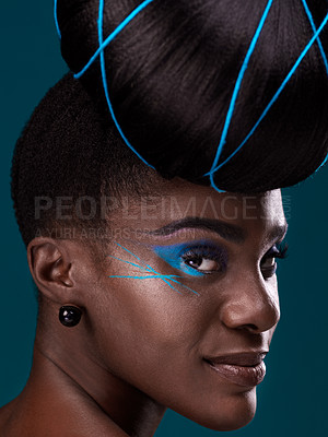 Buy stock photo Portrait, hair and makeup with a black woman closeup in studio on a blue background for beauty. Face, haircare and cosmetics with an attractive young female model at the salon for fashion or styling