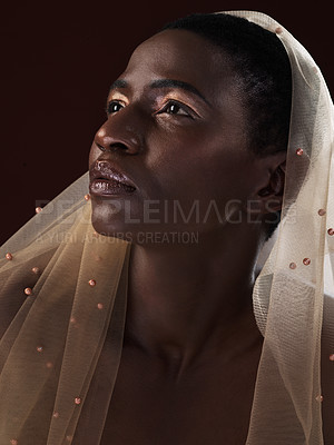 Buy stock photo African, fashion or woman thinking of makeup, scarf or confidence glow in studio on black background. Editorial, face or model with traditional wrap, eyeshadow cosmetics or skincare beauty in Ghana