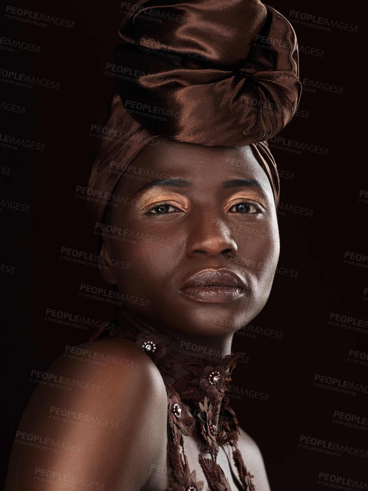 Buy stock photo African, portrait or woman with makeup, turban or necklace in studio on black background in Ghana. Skincare, face and proud model with beauty, eyeshadow cosmetics and traditional fashion for culture