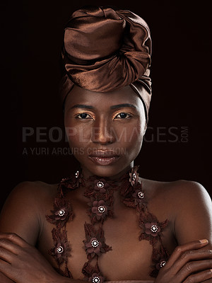 Buy stock photo Turban, portrait or African woman with makeup, arms crossed or pride in studio on black background. Glow, face and serious model with beauty, eyeshadow cosmetics and fashion for culture tradition