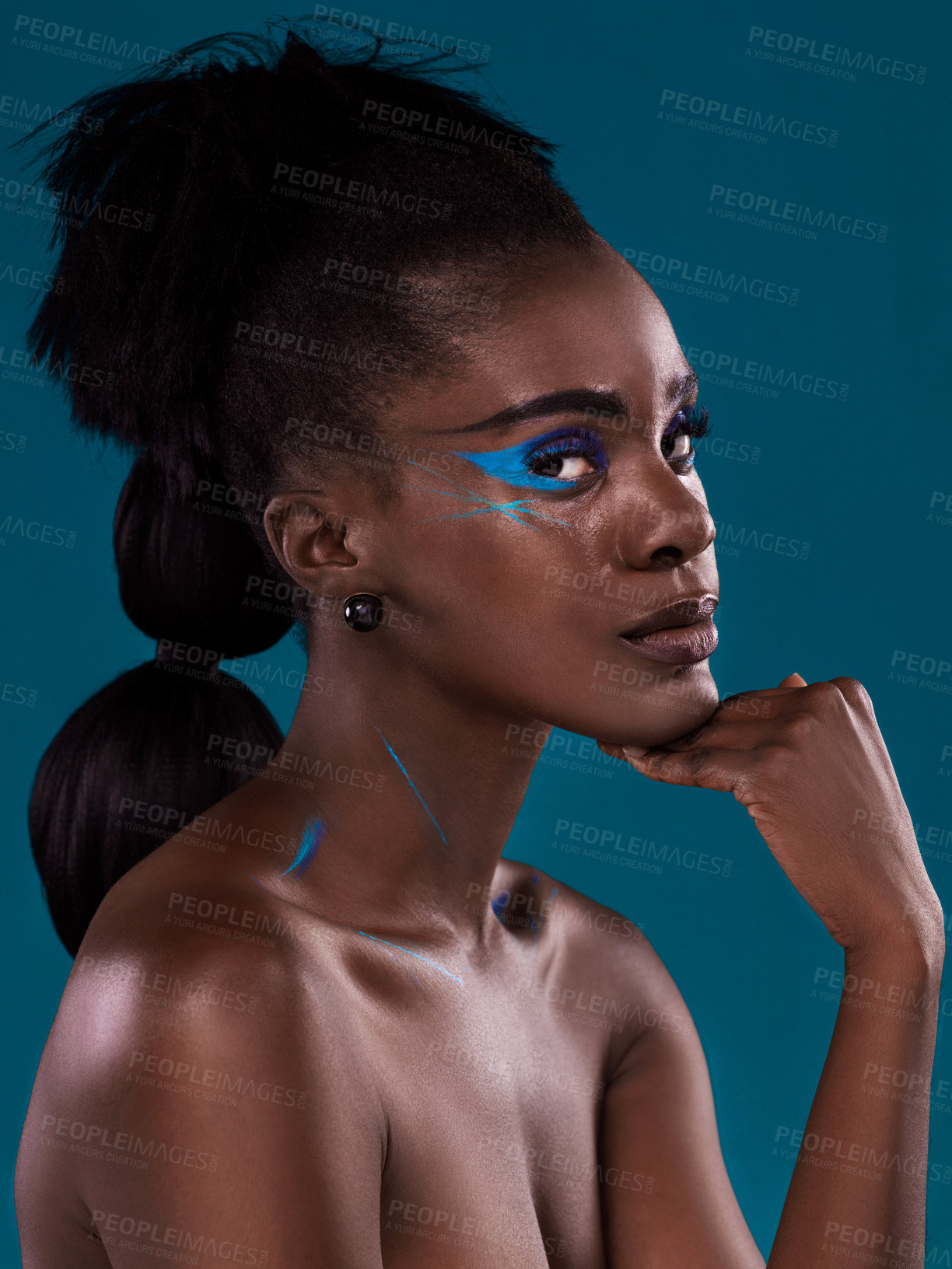 Buy stock photo Portrait, natural hair and cosmetics with a black woman in studio on a blue background for beauty. Face, haircare and makeup with an attractive young female model at the salon for fashion or styling
