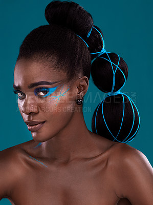Buy stock photo Portrait, hair and makeup with an african woman model in studio on a blue background for haircare or fashion. Face, cosmetics and style with an attractive young female person posing for haircare