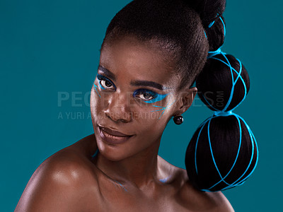 Buy stock photo Portrait, beauty and makeup with an african woman in studio on a blue background for hair or cosmetics. Face, haircare and fashion with an attractive young female model at the salon for style